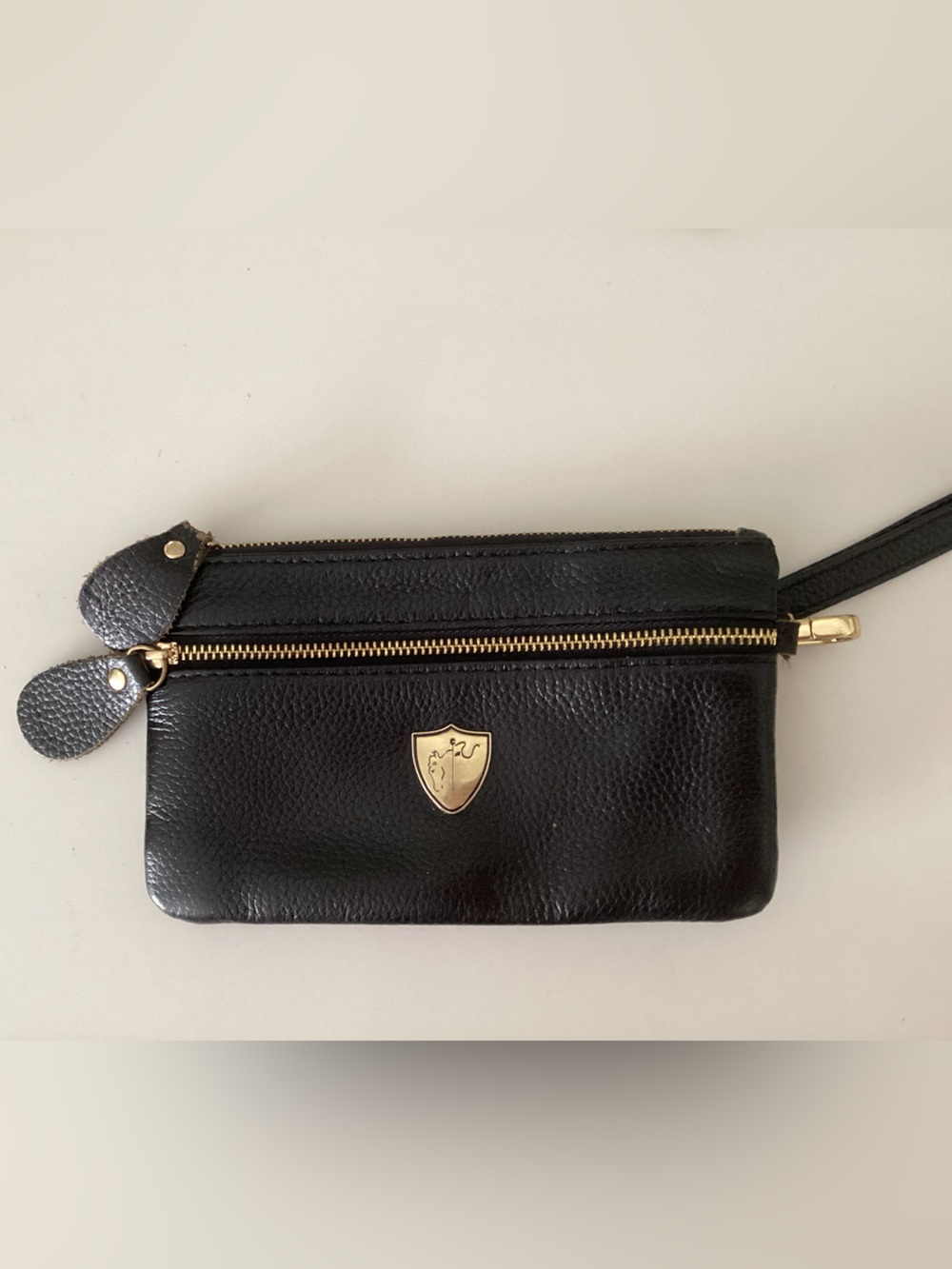 Textured Black Leather Wristlet with Gold Shield Accent